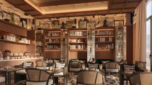 a restaurant with tables and chairs in a room at BLESS Barcelona - New Opening 2026 in Barcelona