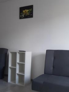 a living room with a couch and a table at Agroturystyka u Pauliny in Sąpów