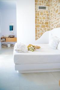 a bedroom with two beds in a room at Nevo Mykonos in Mikonos