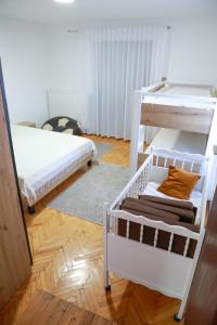 a room with two bunk beds and a rug at Sokolovic STD in Lapotince +68 photos