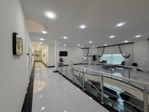 a hospital hallway with a large aquarium in it at CMC Hotel Apartment in Samarkand