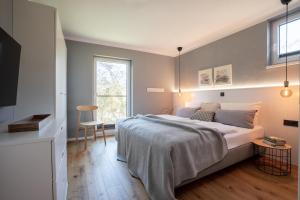 a bedroom with a large bed and a window at Ferienwohnung 1 K20 in Borkum