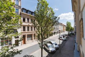 a city street with cars parked on the street at Altstadt Suite in Freiberg