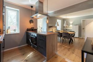 a kitchen and dining room with a dining table at Ferienwohnung 2 K20 in Borkum