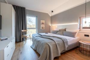 a bedroom with a large bed and a window at Ferienwohnung 2 K20 in Borkum