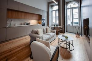 a living room with a couch and a table at Darm in Lamego