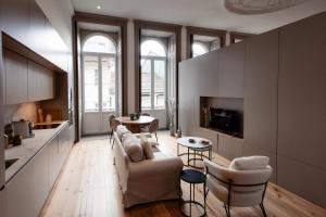 a living room with a couch and chairs and a table at Darm in Lamego +46 photos