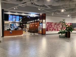 a lobby of a restaurant with a counter and plants at Premium Twin King Ensuites apartment with Double Sofa Bed at M-city Apartment Complex - Infinite Mountain View - Monash Uni & Hospital Clayton, 3168, Victoria, Australia - Free parking, Wifi, Amenities, Tea and Coffee in Clayton North +45 photos