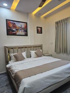 a bedroom with a large bed in a room at The Ushmaya Lifestyle Wellness Resort Near Rishikesh in Haridwār +31 photos