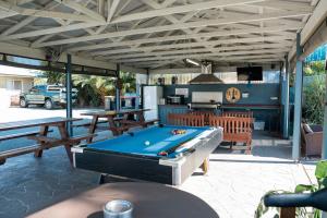 a patio with a pool table and a grill at Sunrise Motel in Barooga