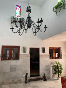 a chandelier hanging from a ceiling in a room at Guest Wing at Casa Africa in Lorca