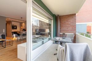 a living room with a table and a dining room at Ferienwohnung Deck7 in Borkum