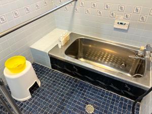 a bathroom with a toilet and a sink at さつき邸 -Satsuki House- in Fukuoka