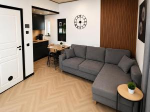 a living room with a couch and a table at Pärnu Summer Studio in Pärnu