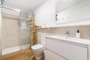 a bathroom with a toilet and a sink and a shower at Numancia 1-4B in Las Palmas de Gran Canaria +43 photos