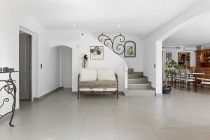 a living room with a couch and a staircase at Maison avec piscine Soleil d'Azur in Fréjus +33 photos
