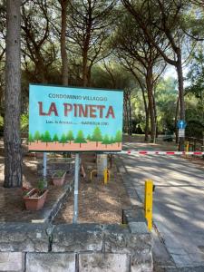 a sign that says la pinea in a park at Casa Merella in Narbolia +2 photos