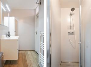 a bathroom with a shower and a sink at Huisje De Koning in Zandvoort +28 photos