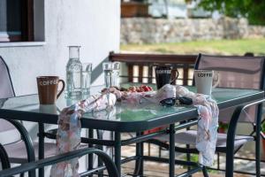 a table with a table cloth on top of it at Exochiko Kalamitsi in Kalamitsi
