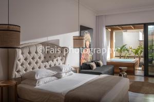 เตียงในห้องที่ Casa Maria Malia