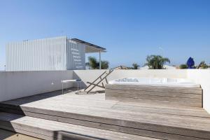 a bath tub sitting on top of a building at Villa D'Argento in Ragusa