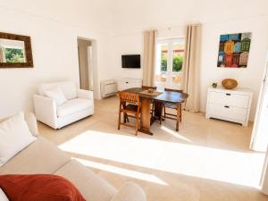 a living room with a couch and a table at Maridea - Villa Alta Marea in Ponza