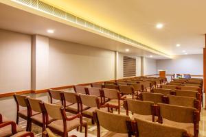 an empty lecture hall with rows of chairs at HOTEL GANGa in Mūvattupula
