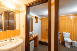 a bathroom with a toilet and a sink at Absinthia Legacy in Soroni +21 photos