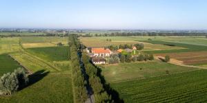 an aerial view of a house in the middle of a field at Huis Leon in Houthulst