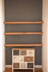 a shelf in a room with four drawers at Agnes homestead in Welshpool