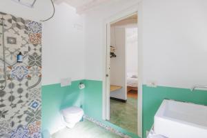 a bathroom with a sink and a mirror at Agriturismo Valleponci in Finale Ligure +60 photos