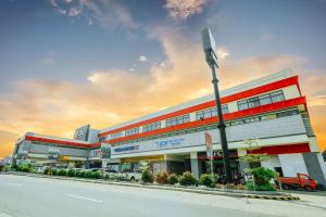a building on the side of a street with a street light at Hotel La Vista by Grotto Vista in Mangangpico