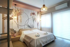 a bedroom with a bed with two towels on it at La Terrazza del benessere in Ferrazzano