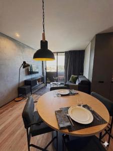 a living room with a table with chairs and a living room at Fisherman's View in Aveiro