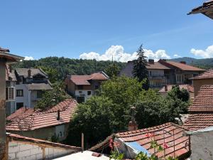 a view of a town with houses and roofs at Къща за гости Гергана in Troyan