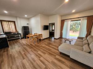 a living room with a couch and a table at Soul House - Stay Beautifully in Ko Kong Nui