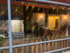 a porch of a house with lights on it at Sai beach Resort in Diveagar