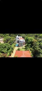 an aerial view of a large house with a yard at La reve ecr , Panaiyur in Chennai