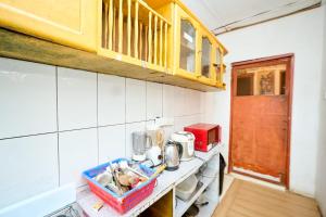 a small kitchen with a counter with a sink at A & J Services in Tesa