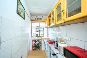 a small kitchen with a counter and a sink at A & J Services in Tesa +5 photos