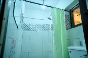 a bathroom with a shower and a toilet at A & J Services in Tesa
