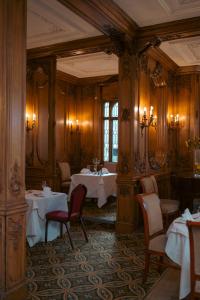 a restaurant with tables and chairs in a room at White Swan Hotel in Alnwick +46 photos