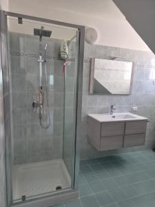 a bathroom with a shower and a sink at Aurora House in Càbras +18 photos