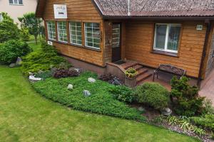 a house with a garden in front of it at Zofija in Birštonas +10 photos