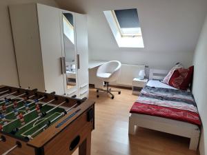 a childs bedroom with a foosball table at Bella Vista in Burgstaedt