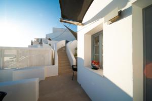 a view of a balcony of a building at Imera Vista Suites in Imerovigli