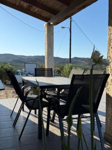 a table and chairs on a patio with a view at Kalithea Apartement in Palekastron