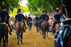 a group of people riding horses down a dirt road at Casa Carlo in Sinj