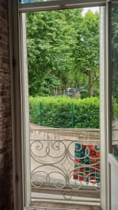 a window with a view of a fence and trees at Cool in Cévennes in Le Vigan