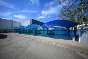 a building with blue domes in a parking lot at Hotel Vaka in Brno